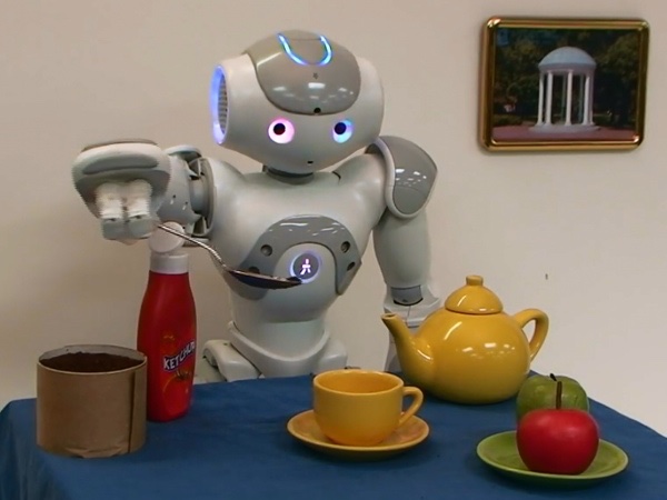 The Nao robot learns to use a spoon to transfer powder